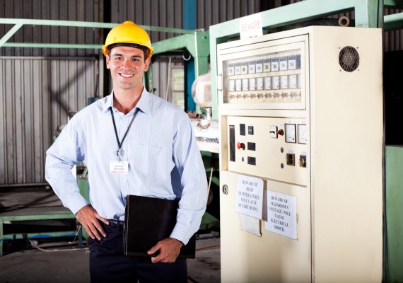 Male industiral engineer portrait in factory